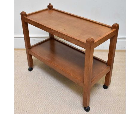WORKSHOP OF ROBERT THOMPSON; an oak two tier trolley, height 71cm, length 85cm, depth 39cm.Condition Report: Cup ring and min