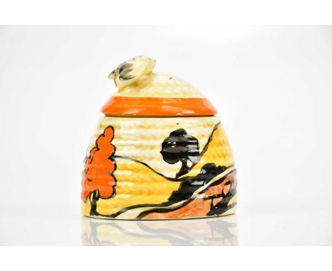 CLARICE CLIFF; a Bizarre range Beehive honeypot and cover in the 'House &amp; Bridge' pattern, height 7.5cm.Condition Report: