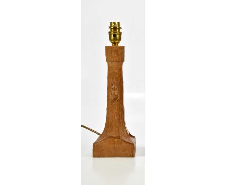 WORKSHOP OF ROBERT MOUSEMAN THOMPSON; a carved oak table lamp with adzed decoration, height 26cm.Condition Report: Minor wate