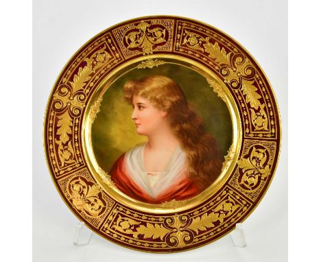 A BPM Berlin porcelain circular cabinet plate, the outer edge finely jewelled and painted with scrolling and floral detail, t