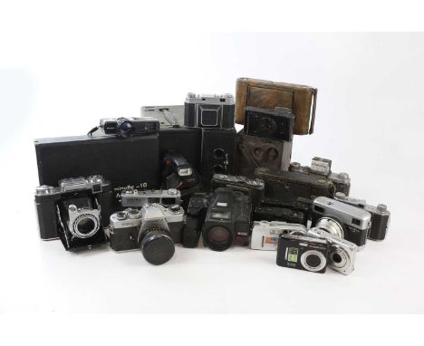 A collection of cameras, including film and digital, to include Box Brownies, a Minolta Hi-Matic, Kodak Retina, a Werra Mat, 