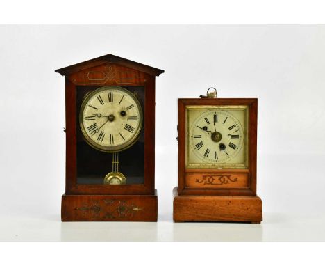 Two late 19th/early 20th century American mantel clocks (for restoration).Condition Report: The smaller clock with heavy worm