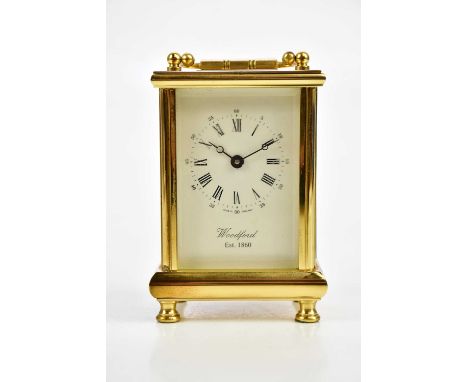 WOODFORD; a brass cased carriage clock, the enamel dial set with Roman and Arabic numerals, height 12cm.Condition Report: PLE