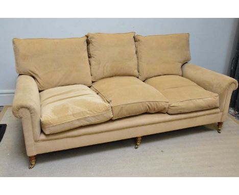 GEORGE SMITH, NEWCASTLE; a modern three seater sofa upholstered in a light brown material, width 210cm.Condition Report: Gene