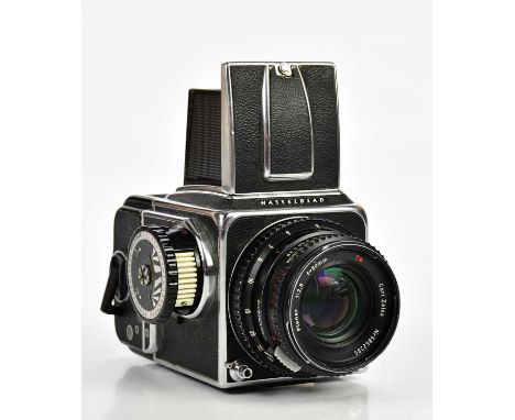 HASSELBLAD; a Hasselblad 500 C/M 120mm medium format camera, serial No UP 144212, with a 120 film back, serial No RH 3214126,