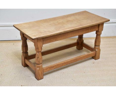 WORKSHOP OF ROBERT MOUSEMAN THOMPSON; a rectangular coffee table with adzed top, on block legs, width 81cm, depth 38cm, heigh