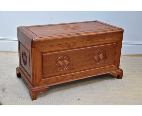  A Chinese carved rosewood blanket box, raised on bracket feet, width 102cm, depth 50cm. 