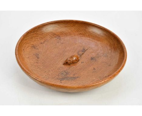 ROBERT 'MOUSEMAN' THOMPSON; a shallow oak fruit bowl with carved mouse to centre, diameter 29cm.Condition Report: Staining an