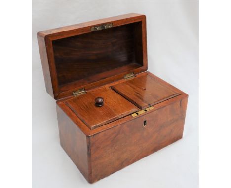 A Victorian figured walnut tea caddy, of rectangular form, the hinged top enclosing a two division lidded interior, 22cm wide