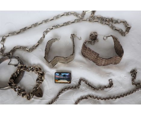 A silver eight bar bracelet together with another similar, silver necklaces, silver bangle, etc approximately 239 grams