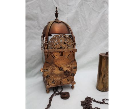 A 17th Century style brass lantern clock, the thirty hour weight driven movement having a verge escapement striking the hours