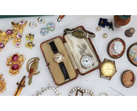 A Lady's 18ct yellow gold wristwatch with a silvered dial and Arabic numerals on a leather strap and assorted costume jewelle