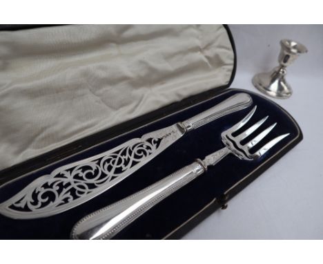 A pair of Victorian silver knife and fork fish servers, with pierced blade and tines, Sheffield, 1877, Martin Hall and co., c