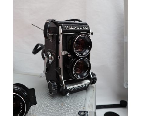 A Mamiya C330 professional camera, No.D137733, together with a Sekonic L-398 light meter, other lenses, lights, cases etc