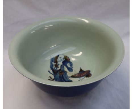 A large Chinese porcelain bowl with a blue ground, the interior decorated with a figure, seal mark to the base, 29cm diameter