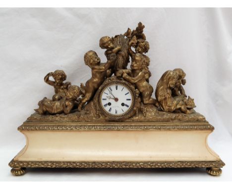 A 19th century gilt metal and alabaster mantle clock, decorated with cherubs holding fruiting vines and wheat sheaves, the di
