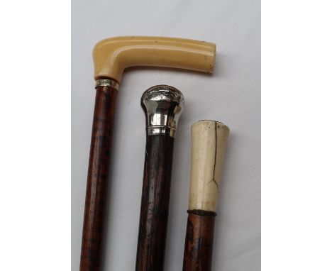 A silver topped walking stick, together with a bone topped walking stick and another walking stick