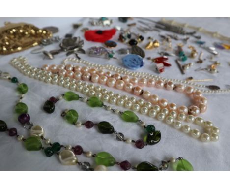 Assorted costume jewellery including a faux pearl necklace, bead necklaces, wristwatch, brooches etc