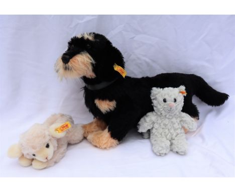 A Steiff wire haired dachshund, together with a Steiff lamb and a Steiff teddy bear