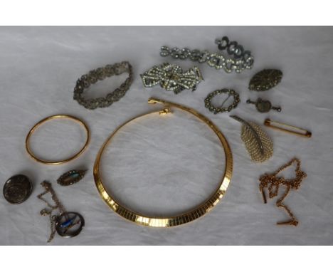 A yellow metal bangle together with yellow metal necklaces and assorted costume jewellery