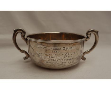 A George V silver twin handled sugar basin, with a line decorated top and scrolling handles, Birmingham, 1926, approximately 