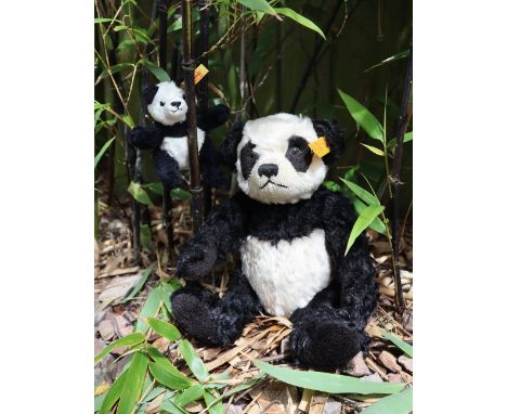 A Steiff panda teddy bear, with articulated limbs, together with a miniature Steiff Panda