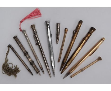 A hallmarked silver propelling pencil together with a gold filled Eversharp propelling pencil, other sterling silver propelli
