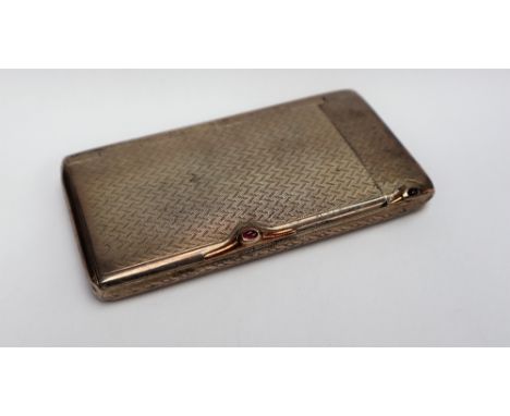 A German 900 standard white metal cigarette case, of rectangular form with two sections and engine turned decoration, 10 x 5.