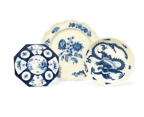 An unusual English blue and white plate, c.1800, painted with a central flower spray, the gadrooned silver-shape rim with fur