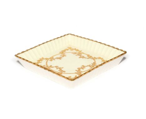 A Sèvres square tray (plateau carre cannele), c.1760, the well gilded with a continuous berried leaf garland entwining around