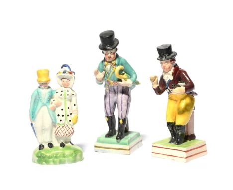 Two Staffordshire theatrical figures of the actor John Liston, c.1820, in his role as Paul Pry with an umbrella tucked under 