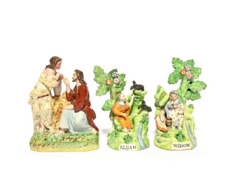 A pair of Staffordshire figures of Elijah and the Widow, late 19th century, seated beneath flowering bocage, and a Staffordsh