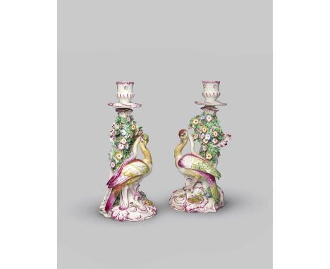 PLEASE NOTE - These are Continental copies of a later date.A rare pair of Bow candlestick figures of birds, c.1765, each mode