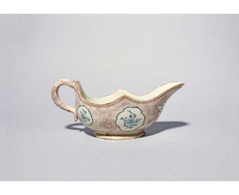 A rare delftware sauceboat, c.1745-55, probably Bristol or Wincanton, the generous form painted with five small panels of flo