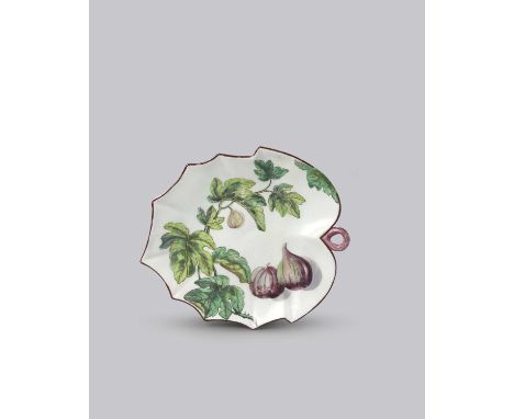 A Chelsea Hans Sloane leaf dish, c.1755, painted with a fruiting spray of a fig tree and two ripe figs within a brown line ri