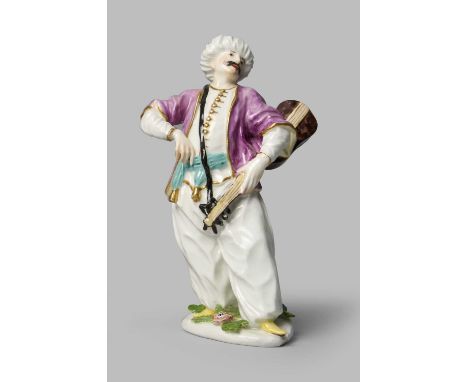 A Meissen figure of a Turkish musician, c.1745, modelled by P Reinicke and J F Eberlein after Le Turk Amoreux by Georg Friedr
