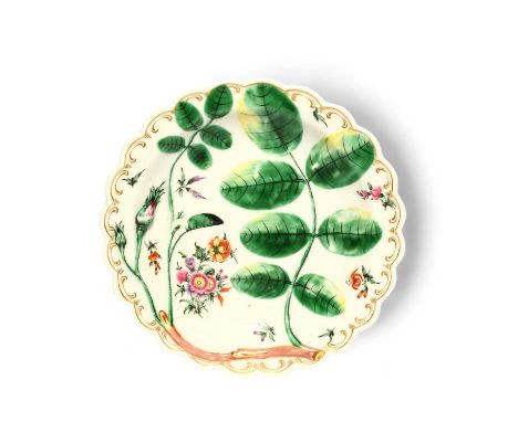 A Worcester Blind Earl plate, c.1770, moulded and painted with a rosebud and leaves, painted inbetween with small sprays of f