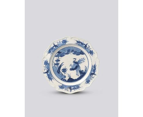 A rare Chelsea blue and white plate, c.1754-55, of cinquefoil form, painted after a Japanese Kakiemon design with two long-ta
