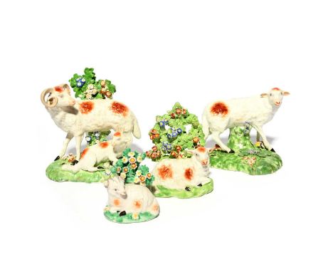 Four Derby porcelain figures of sheep, c.1760-80, one of a ram standing with a recumbent kid at his feet, another of a ewe st
