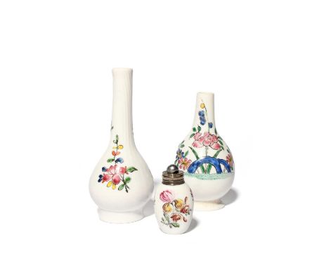 Two South Staffordshire opaque white glass bottles, c.1755, one with wrythen-moulding to the neck and painted with flower spr