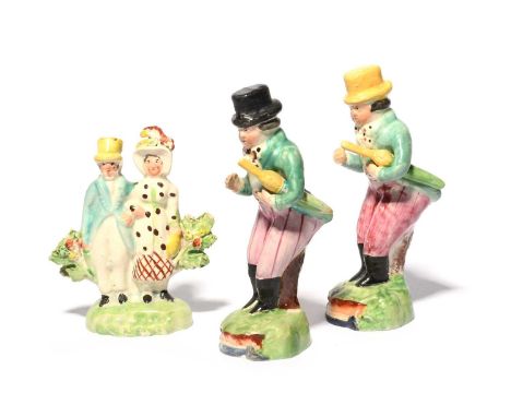 Two Staffordshire theatrical figures of John Liston, c.1820, in his role of Paul Pry with his umbrella tucked under one arm, 