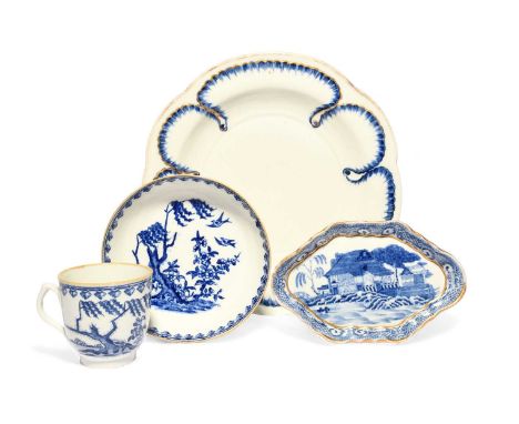 A rare New Hall plate in the Sèvres style, c.1785-90, moulded and painted in blue with feuille de choux borders, a New Hall b