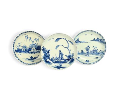 Three Vauxhall blue and white saucers, c.1755-58, one painted with a Chinese lady standing behind a fence and talking to a fi