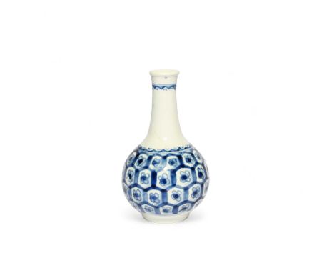 A small Vauxhall blue and white bottle vase, c.1758, the globular body painted with flowerhead motifs within a hexagonal diap