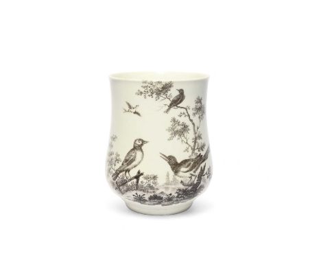 A Worcester campana-shaped mug, c.1760, printed in black with the Magpie and Finch pattern, the birds perched on a low fence 