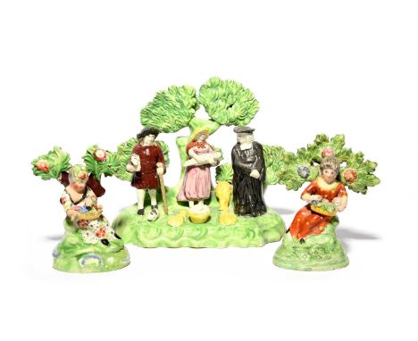 A Staffordshire Tithe Pig group, early 19th century, modelled with a parson standing with a farming couple offering their tit