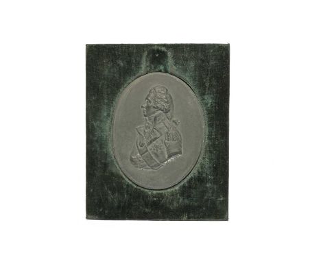 A Wedgwood black basalt plaque of Lord Admiral Nelson, 19th century, facing left and depicted as a head and shoulders profile