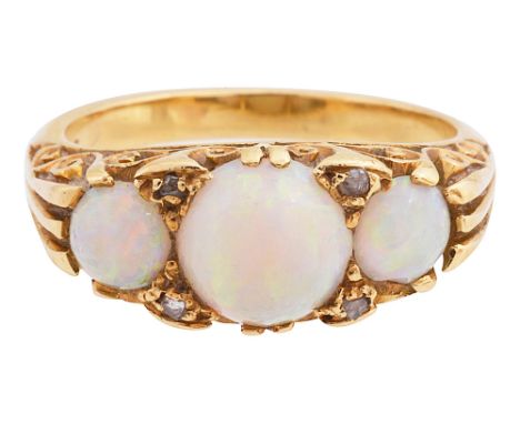 A late Victorian opal ring the three graduated opal cabochons with diamond points between to the scrolling pierced gallery an