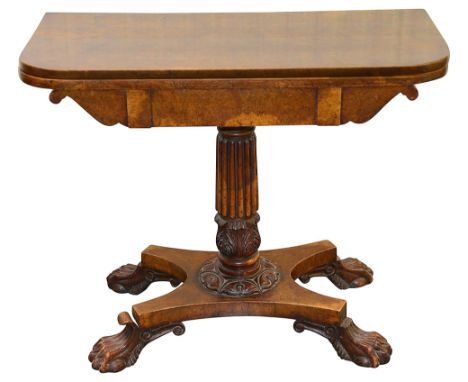 A William IV pollard oak card tablecirca 1830the swivel foldover top revealing a baize inset, the reeded and acanthus carved 