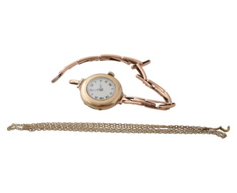 A lady's 9ct gold manual wind wristwatchcircular white enamel dial with black Roman numerals, and manual track, expandable sp